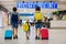 Sweet childre, brothers, boys, waking hand in hand at the airport, carrying suitcases and backpacks