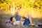 Sweet children, boys, playing in the park on sunset, autumn