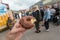 Sweet chocolat donut in hand of visitor of the street food market of Copenhagen, Denmark. Leisure in Scandinavia