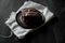 Sweet chocolate brownie with coffe cream on a dark, rustic, wooden table