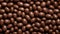 Sweet Chocolate-Covered Nuts Candy Horizontal Background.