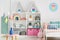 Sweet colorful decorations and white furniture in a fun kid`s be