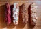 Sweet and colorful eclair on wooden background. french eclair. top view