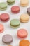 Sweet colorful macarons on white background soft focus