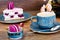 Sweet and Colourful Cake with French Macaroons with Cup of Cofee