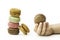 Sweet and colourful french macaroons with girl hand holding