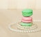 Sweet and colourful french macaroons and pearls