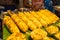 Sweet corn with butter grilled on the charcoal stove in the market.Thailand