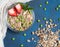 Sweet country breakfast: granola with strawberries and Green peas on vintage background. Top view, flat lay