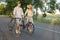 Sweet Couple Wheeling Bikes After Rural Trip