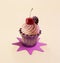 Sweet Creamy Cupcake with Topping on the beige background