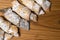 sweet crispy cookies with poppy seeds and powdered sugar on a wooden background