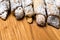 sweet crispy cookies with poppy seeds and powdered sugar on a wooden background