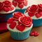 Sweet cupcake decorated with red roses and cream hearts