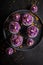 Sweet cupcakes with flower shaped purple cream