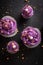 Sweet cupcakes made of purple cream for fat thursday