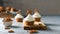 Sweet cupcakes with whipped cream and brezel on wooden board. Bakery, confectionery banner, cookbook recipe, menu. Side view, copy