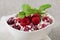 Sweet curd with raspberries, decorated with a sprig of mint