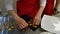 Sweet decorative seashells. Woman lays a sweet decorative shells on a tray