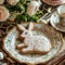 Sweet delicious Easter cookies in the shape of rabbit with glaze and decorative pattern on a beautiful plate on the festive table