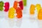 Sweet, delicious gummy bears in small groups, dancing, talking party conceptual image