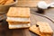 Sweet delicious ice cream cookie sandwiches on board, closeup