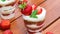 Sweet dessert, cake in cup, decorated strawberries, slow motion