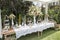 Sweet dessert table or candy bar. Wedding party. Natural light. Macaron and meringue pyramid.