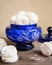 Sweet dessert white zephyr marshmallows in blue glass vase