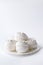 Sweet dessert white zephyr marshmallows on white background