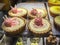 Sweet desserts in restaurant display window.