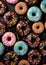 Sweet donuts in blue pink colors from top view.Assorted finest donuts