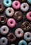 Sweet donuts in blue pink colors from top view.Assorted finest donuts