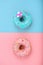 Sweet donuts, blue on pink, pink on blue. Concept conflict of contradictions, individuality in the generalization, the