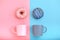 Sweet donuts pink and blue with a mug of coffee. Blue and pink background, game of colors, color conflict. Mock up for