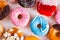 Sweet doughnuts on gray stone background