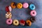 Sweet doughnuts on gray stone background
