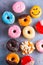 Sweet doughnuts on gray stone background