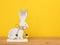sweet easter bunny figure yellow background