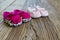 Sweet fancy and colorful baby shoes on the wooden table