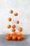 Sweet flying tangerines, on a light background. Levitating food.