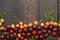 Sweet fresh cherries background. Scattered cherries on blue rustic wood pattern with copy space. Cherry fruit backround. Garden fr