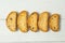Sweet golden crackers with raisins on a white table, diet food