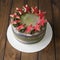 Sweet green-gray cake with decor on 23 february holiday - Red stars cookies and number 23 - on wooden background. Close