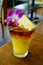 Sweet Hawaiian Mai Tai cocktail with an orchid flower