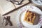 Sweet homemade apple cake. Breakfast and reading on rustic wooden table