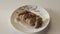 Sweet homemade glazed buns with apples on wooden surface background. Stock footage. Close up of tasty baked pastry good