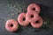 Sweet and homemade pink donuts topped with sprinkles