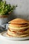 Sweet Homemade Stack of Pancakes with honey for Breakfast on a gray background. Sweet beautiful breakfast. Brunch.