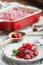 Sweet Homemade Strawberry Cobbler Baked in a Red Ceramic Pan